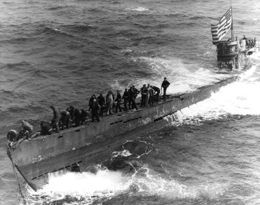 A U.S. Navy boarding party working to secure a tow line to the bow of the captured German submarine U-505, 4 June 1944 (80-G-49172) photo