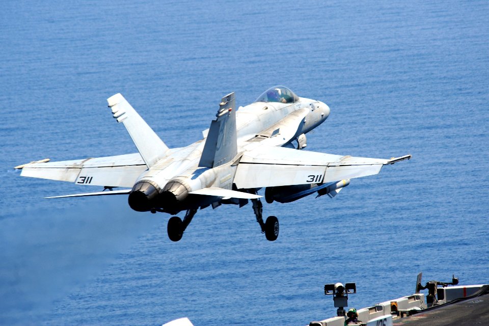 A U.S. Navy F-A-18C Hornet aircraft assigned to Strike Fighter Squadron (VFA) 15 takes off from the aircraft carrier USS George H.W. Bush (CVN 77) Sept 140902-N-CZ979-012