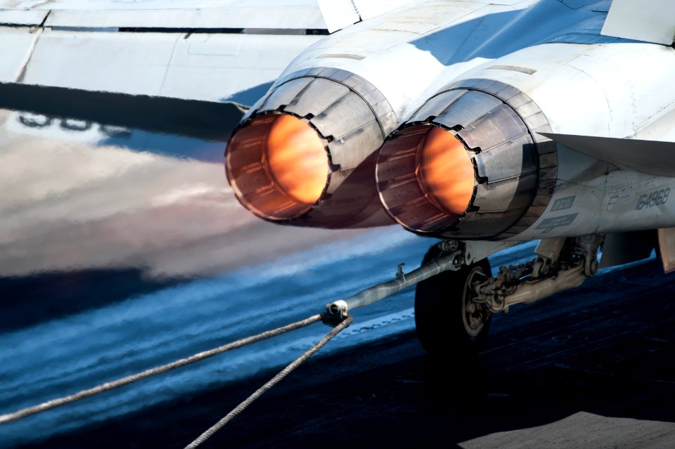 A U.S. Navy F-A-18C Hornet aircraft assigned to Strike Fighter Squadron (VFA) 37 catches an arresting gear wire on the flight deck of the aircraft carrier USS Harry S. Truman (CVN 75) in the Gulf of Oman 140217-N-ZG705-076