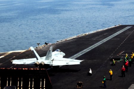 A U.S. Navy F-A-18E Super Hornet aircraft attached to Strike Fighter Squadron (VFA) 31 prepares to take off from the aircraft carrier USS George H.W. Bush (CVN 77) in the Persian Gulf June 30, 2014 140630-N-CZ979-031