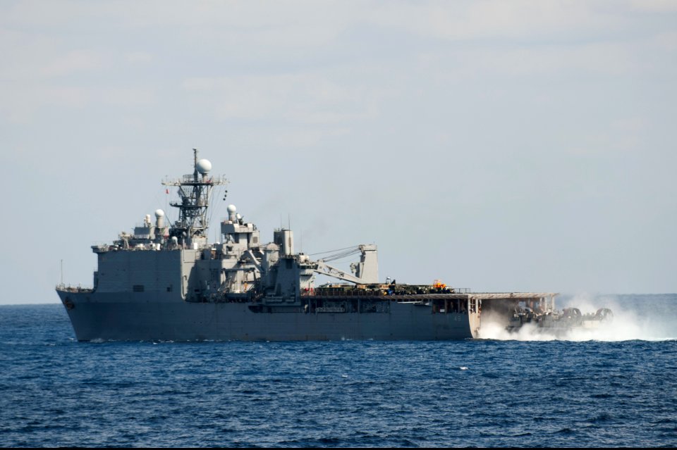 A U.S. Navy landing craft, air cushion enters the well deck of the amphibious dock landing ship USS Ashland (LSD 48) in the East China Sea March 11, 2014 140311-N-LM312-312