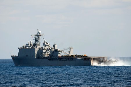 A U.S. Navy landing craft, air cushion enters the well deck of the amphibious dock landing ship USS Ashland (LSD 48) in the East China Sea March 11, 2014 140311-N-LM312-312