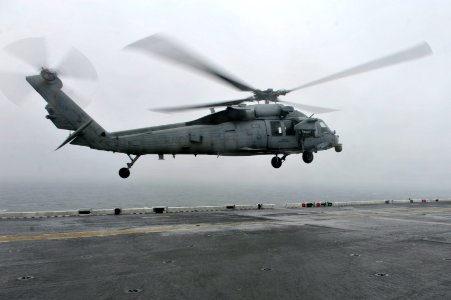 A U.S. Navy MH-60S Seahawk helicopter assigned to Helicopter Sea Combat Squadron (HSC) 25 lands on the flight deck of the amphibious assault ship USS Bonhomme Richard (LHD 6) April 17, 2014, in the East China 140417-N-LM312-003