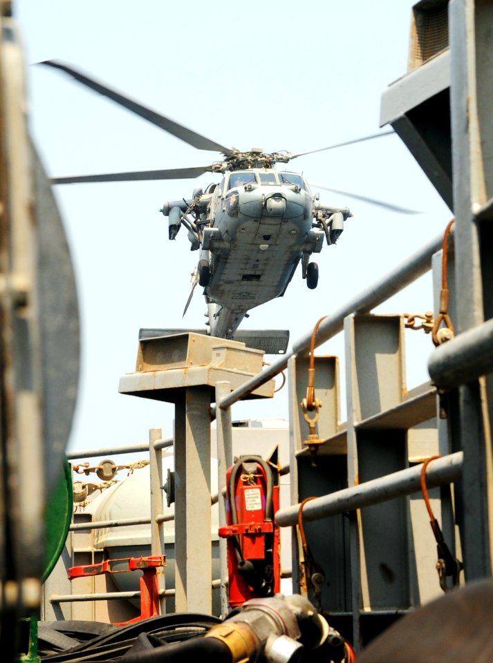 A U.S. Navy MH-60R Seahawk helicopter assigned to Helicopter Maritime Strike Squadron (HSM) 70 prepares to land aboard the aircraft carrier USS George H.W. Bush (CVN 77) in the Persian Gulf Aug. 26, 2014 140826-N-MU440-024