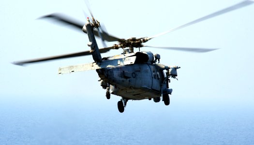 A U.S. Navy MH-60S Seahawk helicopter assigned to Helicopter Sea Combat Squadron (HSC) 9 takes off from the aircraft carrier USS George H.W. Bush (CVN 77), not pictured, in the Persian Gulf Aug. 26, 2014 140826-N-CZ979-004