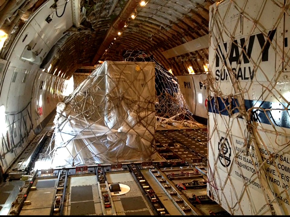A U.S. Navy towed pinger locator and other ocean search and recovery assets sit in a cargo aircraft at John F. Kennedy International Airport in New York City March 24, 2014, before being transported to 140324-N-ZZ999-101