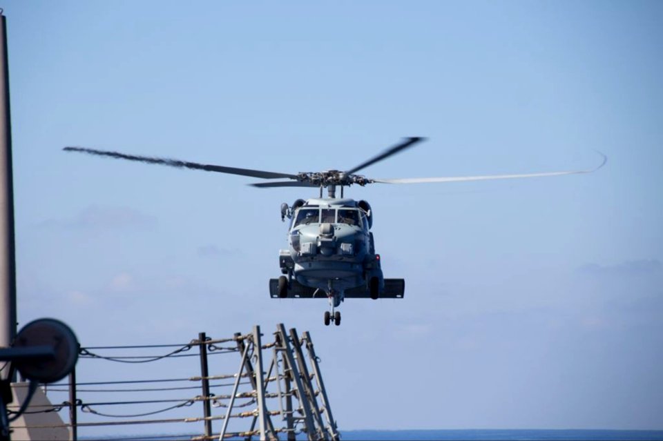 A U.S. Navy SH-60R Seahawk helicopter attached to the guided missile destroyer USS Pinckney (DDG 91) prepares to aid in the search efforts for Malaysia Airlines flight 370 in the Gulf of Thailand March 9, 2014 140309-N-ZZ999-005