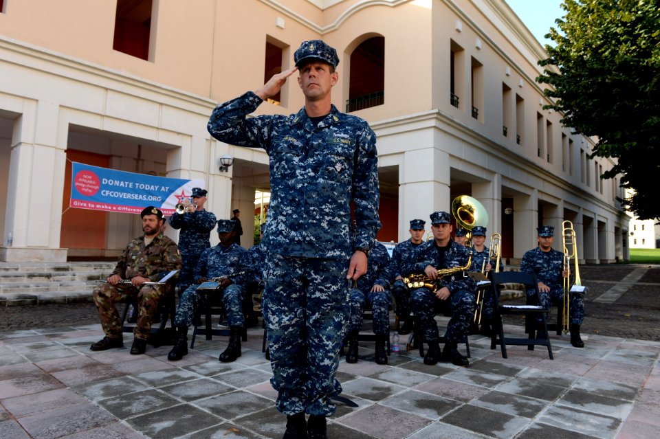 A U.S. Sailor with the U.S. Naval Forces Europe band plays taps as part of a 9-11 memorial ceremony Sept 140911-N-QY759-112