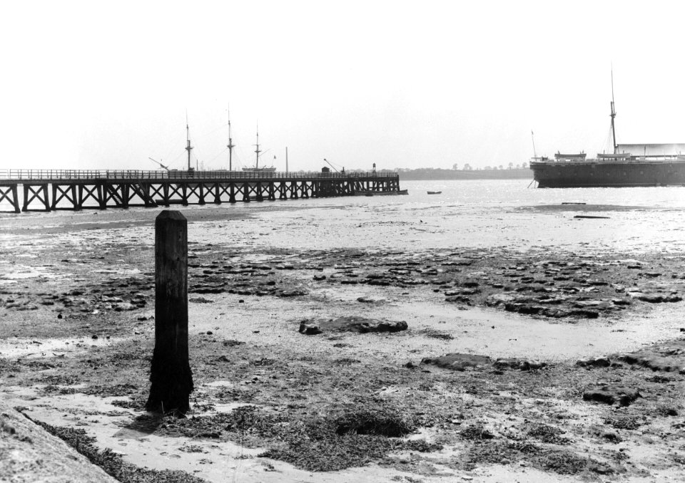 A view looking from the shore towards Shotley pier at low tide. RMG P27498