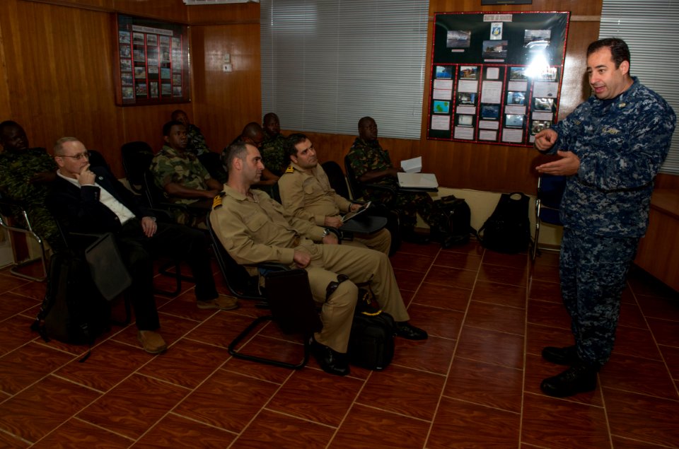 A US Navy Cdr breifing officers on the legal aspects of boarding suspicious vessels at sea