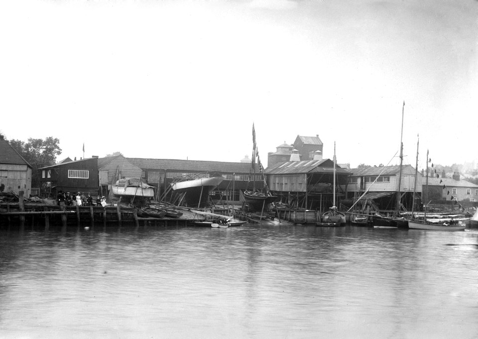 A view of the river frontage of the Harris boatyard taken from the Wivenhoe side of the River Colne. RMG P27525