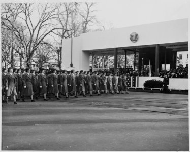 A women's military unit passes in front of President Truman and Vice President Alben Barkley during the inaugural... - NARA - 200058 photo