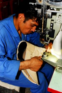 A worker at the Kabul Melli factory handcrafts combat boots (4918977717)