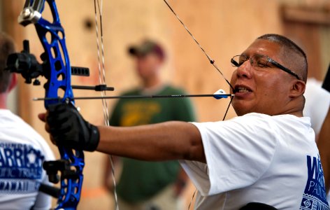 A wounded warrior uses his teeth to fire an arrow. (8199139789)