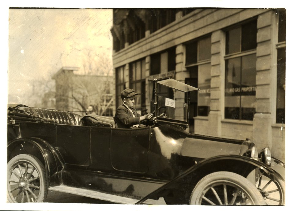 A young chauffeur. See Hine report re- 15-year-old chauffeur in Oklahoma City who killed a man by careless driving. His case was dismissed because he was 'too young to prosecute.' Yet he was LOC nclc.04036