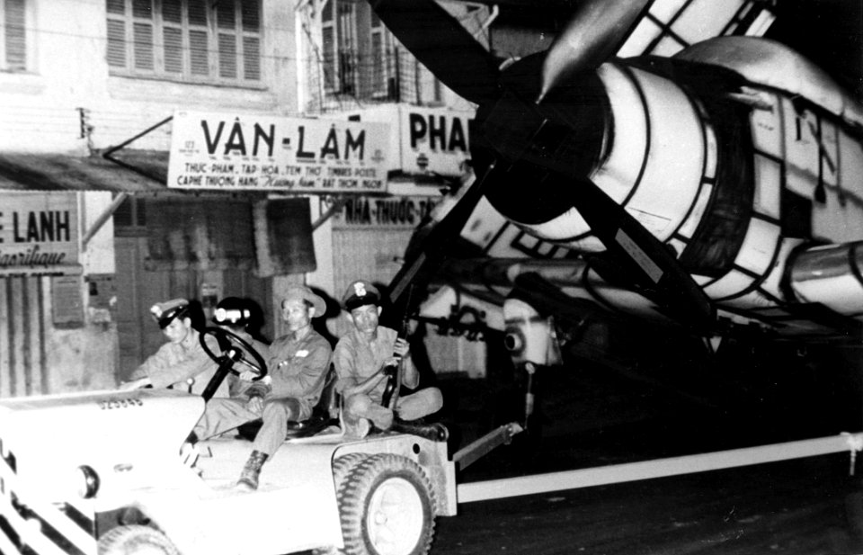 A-1 Skyraider is pulled through Saigon c1965