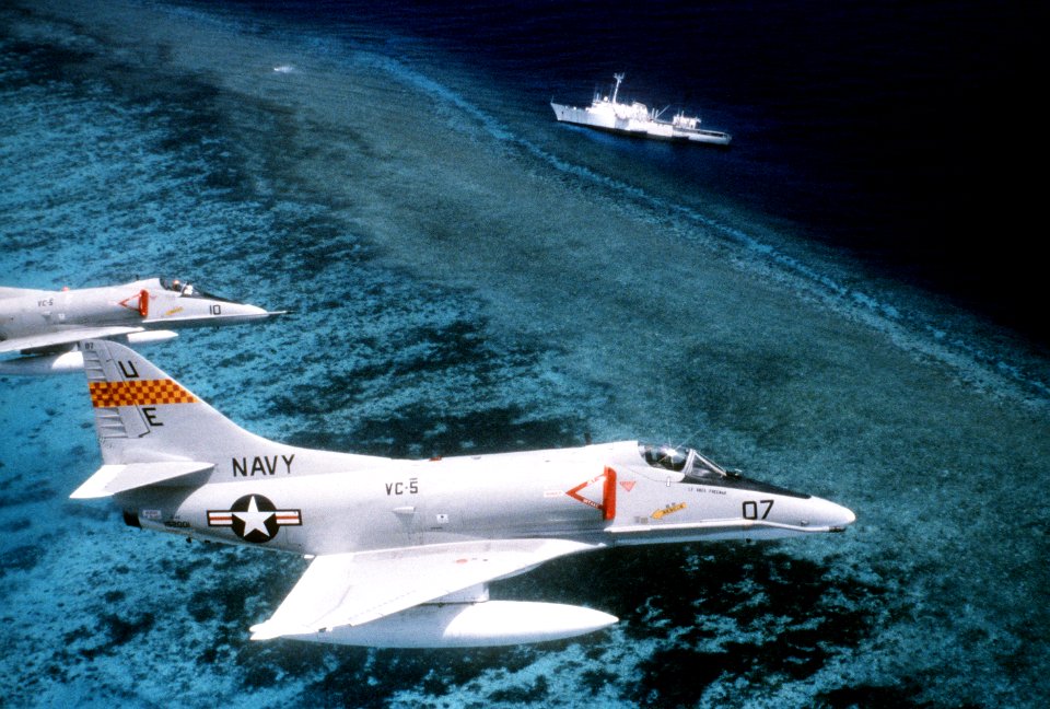 A-4Es of VC-5 in flight over USNS Chauvenet (T-AGS-29) 1981