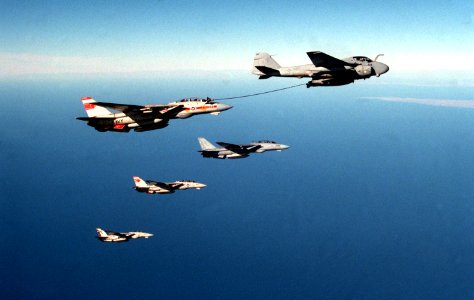 A-6E from VA-145 refuels Tomcats from VF-1 and VF-2 in 1989
