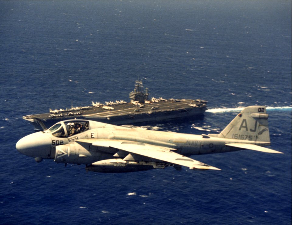 A-6E VA-35 flies over USS Theodore Roosevelt (CVN-71) c1989