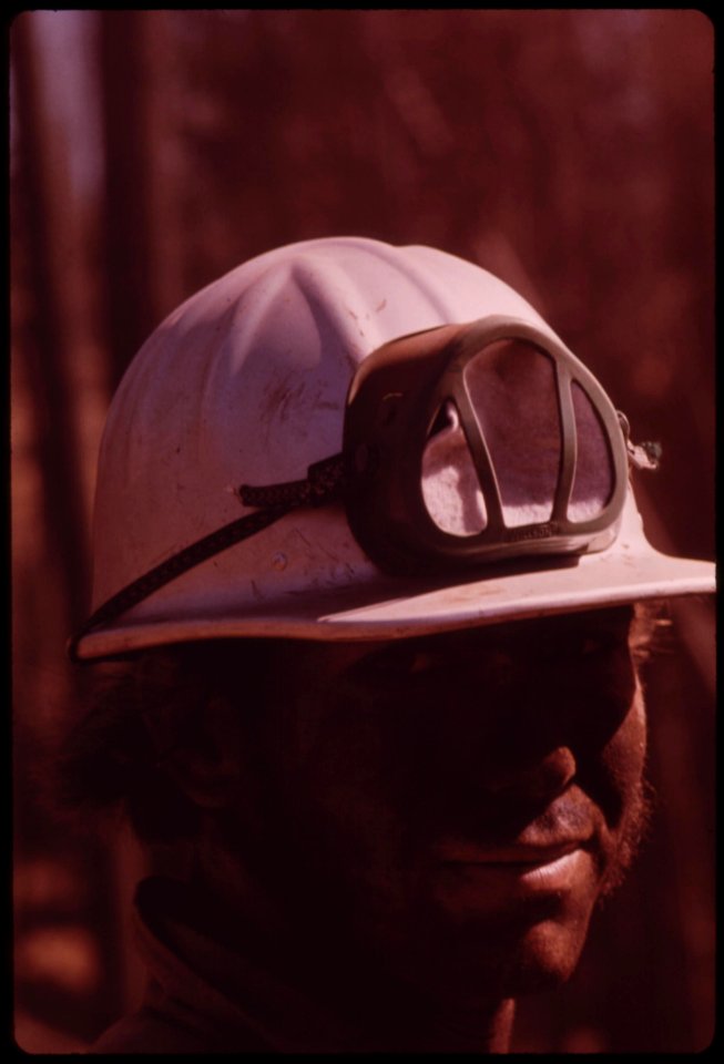 A-cat-skinner-works-in-post-fire-operations-caterpillar-tractors-are-used-to-haul-logs-to-landing-area-where-they-are-loaded-onto-trucks-september-1973 7153096775 o