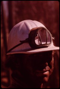 A-cat-skinner-works-in-post-fire-operations-caterpillar-tractors-are-used-to-haul-logs-to-landing-area-where-they-are-loaded-onto-trucks-september-1973 7153096775 o
