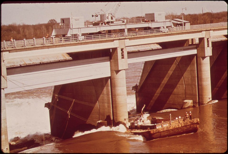 A-liquid-chlorine-barge-after-breaking-loose-from-its-tug-became-lodged-against-the-mcalpine-dam-on-the-ohio-river-and-could-not-be-set-free-march-1972 7651317180 o