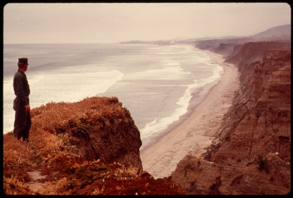 A-marine-patrols-the-shoreline-at-his-camp-pendelton-may-1975 7158892656 o