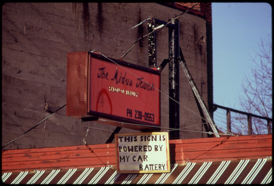 A-car-battery-operated-this-neon-advertising-sign-over-a-business-during-the-energy-crisis-in-december-1973-121973 4271738741 o