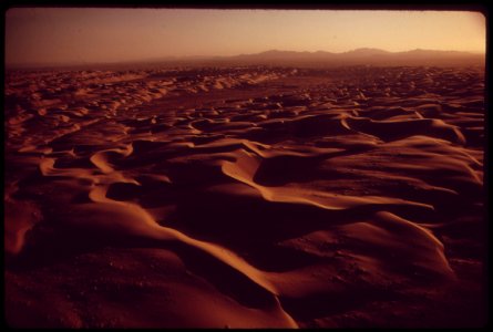 A-hundred-mile-ribbon-of-sand-dunes-separates-the-chocolate-mountains-of-southern-california-from-the-imperial-valley-which-stretches-from-the-salton-sea-into-mexico-may-1972 6990246094 o