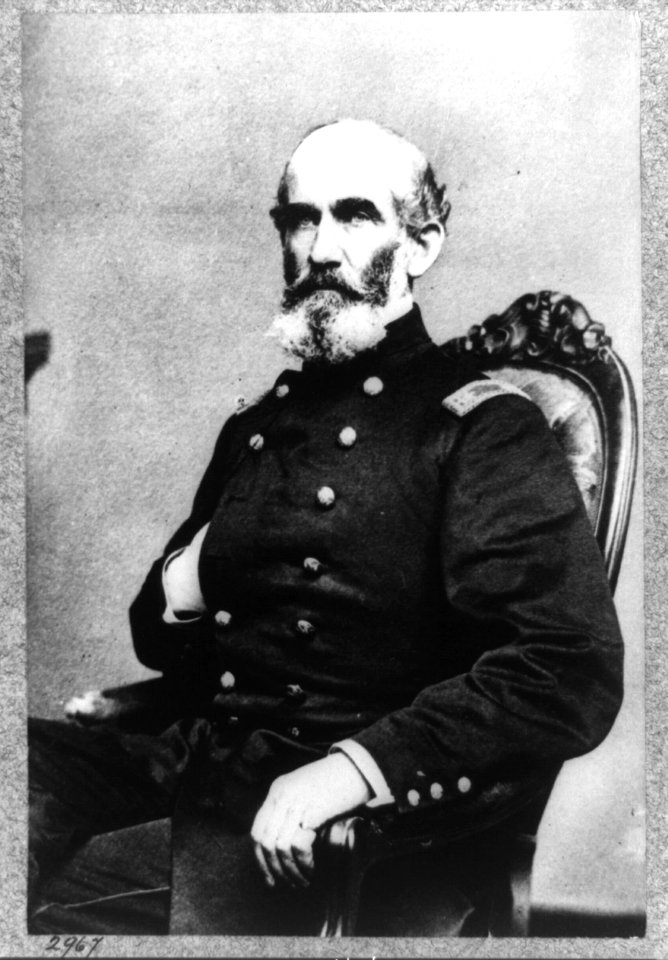 A.J. Smith, three-quarter length portrait, seated, facing right, right hand in his coat LCCN96514028