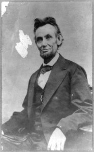 Abraham Lincoln, half-length, seated, facing front, with hand on arm of chair LCCN2007675779