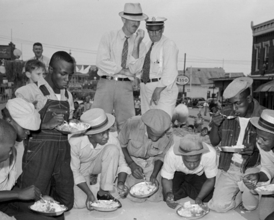 African American males and the white judges detail, Rice Eating Contest in Crowley, 1938 (cropped)