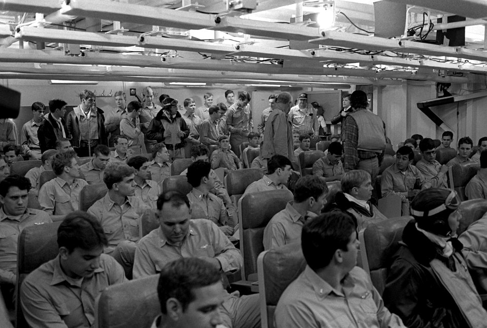 Actors in ready room during The Winds of War TV series filming aboard USS Peleliu (LHA-5) 1981