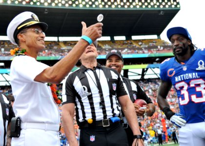 Adm. Haney flips the coin at the Pro Bowl photo