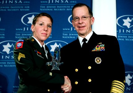 Adm. Mike Mullen poses for a photo with U.S. Army Sgt. Monica L. Brown after presenting her with the 2008 Jewish Institute for National Security Affairs Grateful Nation Award