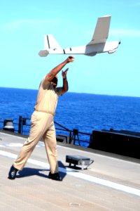 Adm. Sinclair Harris launches a Puma UAV. (8696783142)