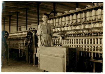Adrienne Pagnette, an adolescent French illiterate, speaks almost no English. Is probably 14 or 15. Doffs on top floor spinning room in Glenallen Mill. Her brother Francis has a regular job LOC cph.3a18654