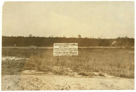 Advertisement by the side of the railroad, Inverness Mills, Winston Salem, N.C.The homes are not in good condition now. I found very few young children working. LOC nclc.02671