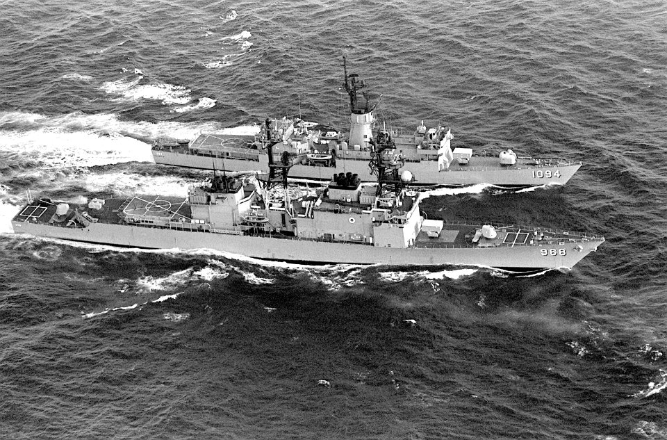 Aerial starboard beam view of USS Pharris (FF-1094) and USS Arthur W. Radford (DD-968) underway during Unitas XXI 1980 DN-SN-83-00276