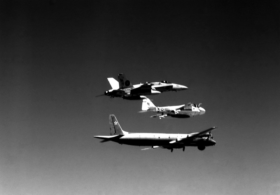 Aerial right side view of Il-38 escorted by VFA-151 FA-18A Hornet and VA-185 KA-6D Intruder September 1989 DN-SN-90-04254