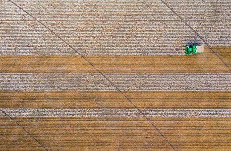 Aerial view of cotton harvester making horizontal stripe in Batesville, Texas field