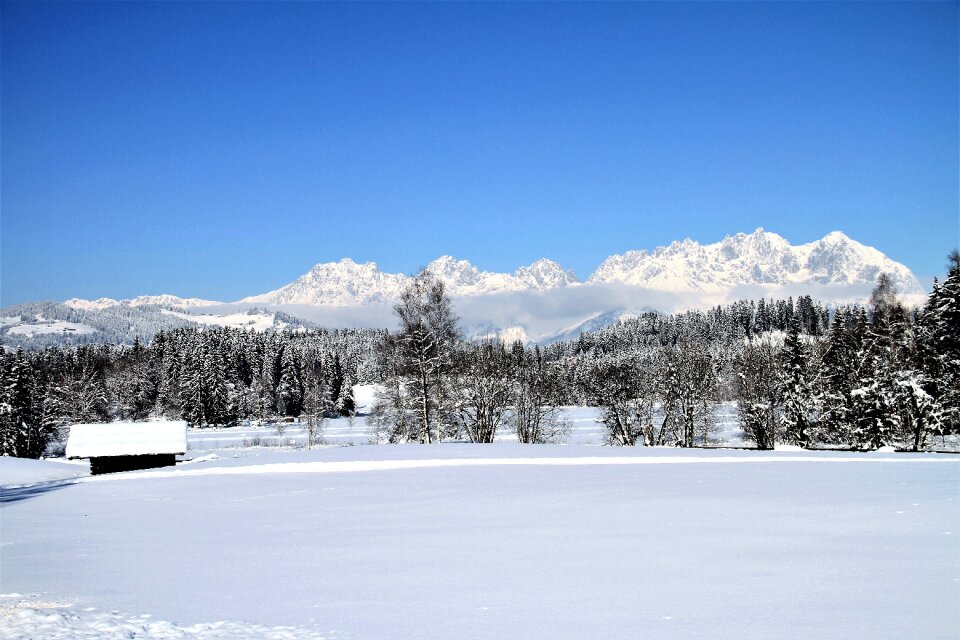 Christmas blue sky log cabin