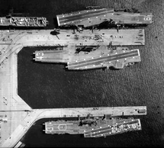 Aerial view of USS Hancock (CVA-19), USS Bon Homme Richard (CVA-31) and USS Coral Sea (CVA-43) in 1966