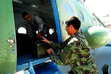 Afghan Air Corps crew loads cases of ammunition for a mission (4693225105)