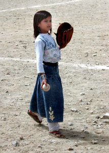 Afghan girl playing baseball in 2002