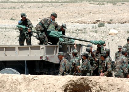 Afghan National Army trainees load two Russain Recoiless Rifles (SPG-9) into the bed of a truck (4706053776)