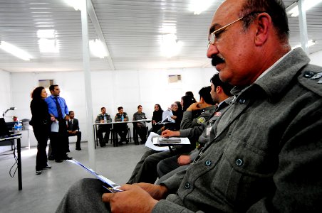 Afghan National Police (ANP) officers listen and compare notes (4508197738) photo