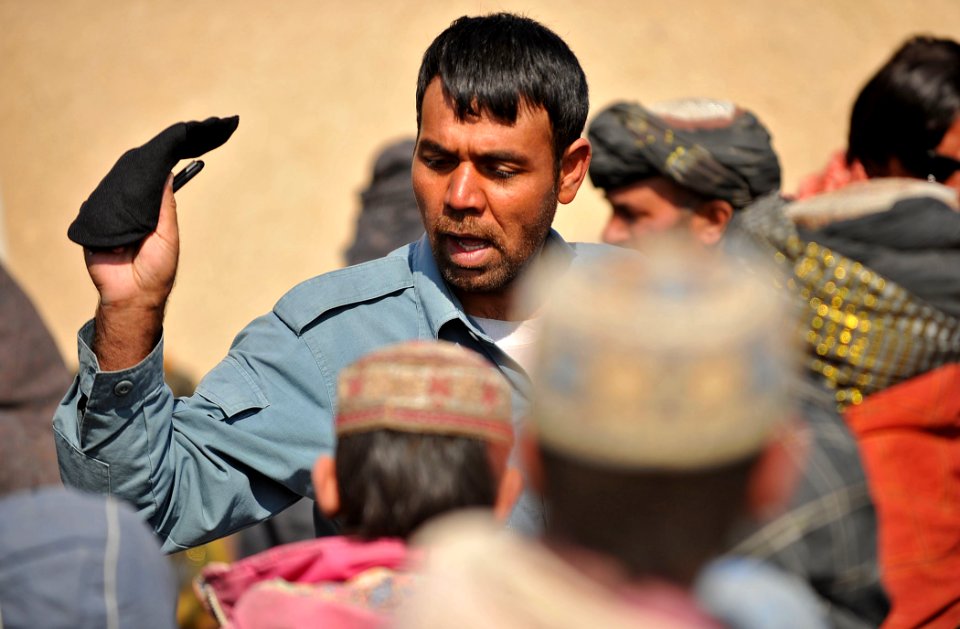 Afghan National Police and coalition special operations forces food handout 120207-N-UD522-099