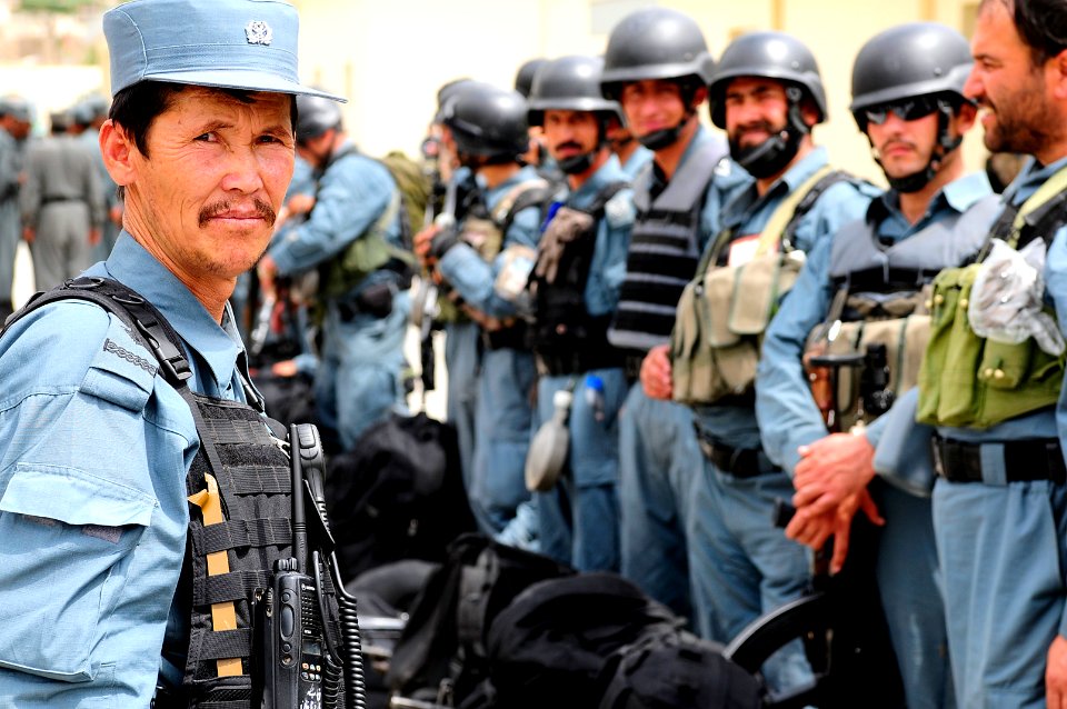 Afghan National Civil Order Police (ANCOP) Non-Commissioned Officer, left, prepares members for an inspection (4527954777)
