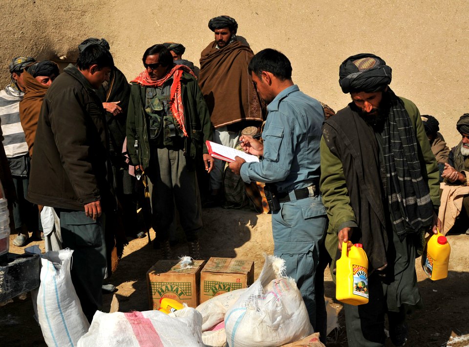 Afghan National Police and coalition special operations forces food handout 120207-N-UD522-055
